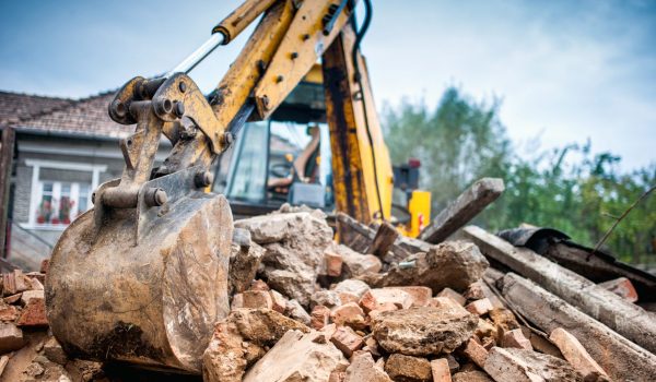 Hydraulic crusher excavator backoe machinery working on site dem Hydraulic crusher excavator backoe machinery working on site demolition
