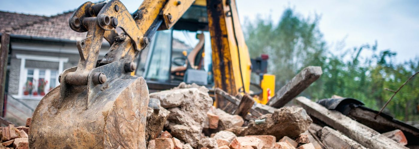 Hydraulic crusher excavator backoe machinery working on site demolition